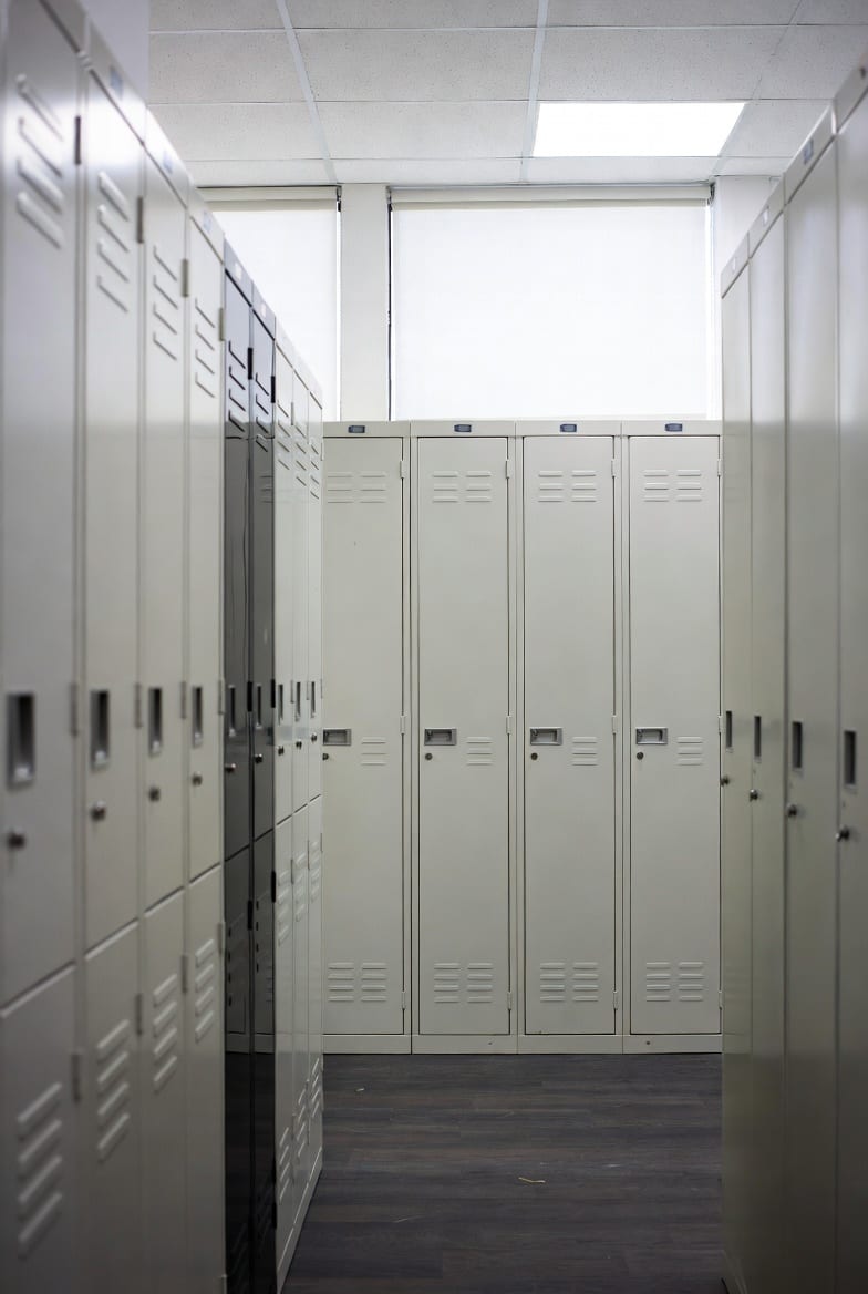 Tidy office with closed metal storage cabinets and lockers creating a clean professional look