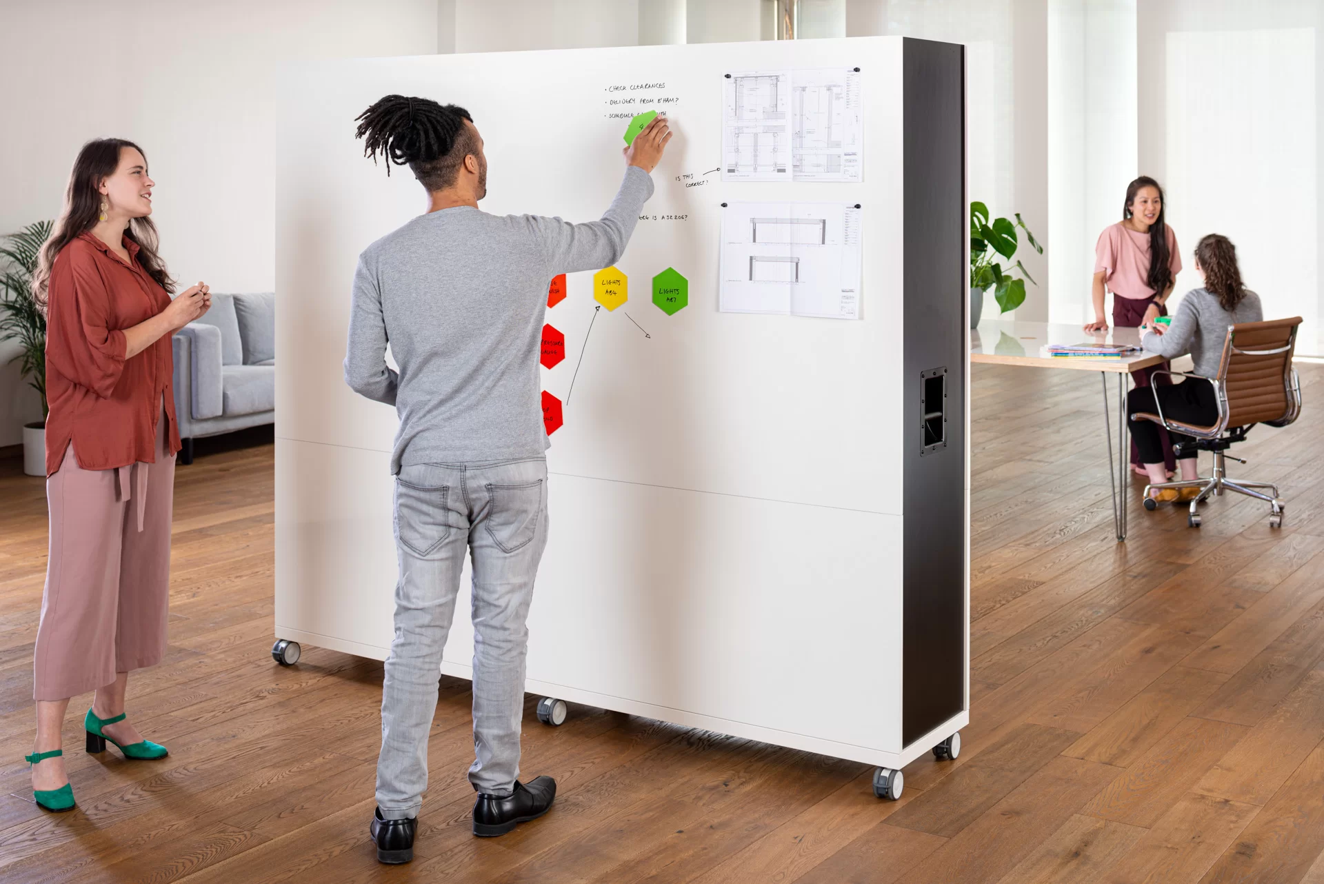 Double-sided mobile whiteboard on wheels in an Auckland office or classroom setting