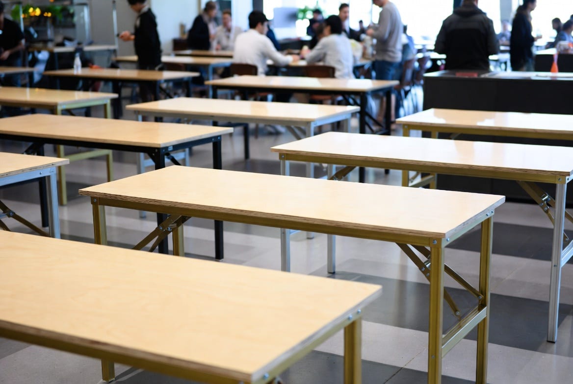 Commercial folding tables in a busy New Zealand hospitality or venue setting