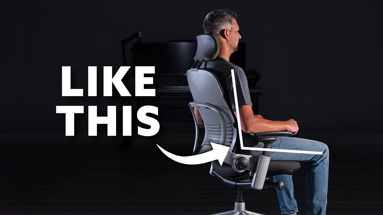 Person demonstrating proper posture in an adjustable ergonomic office chair
