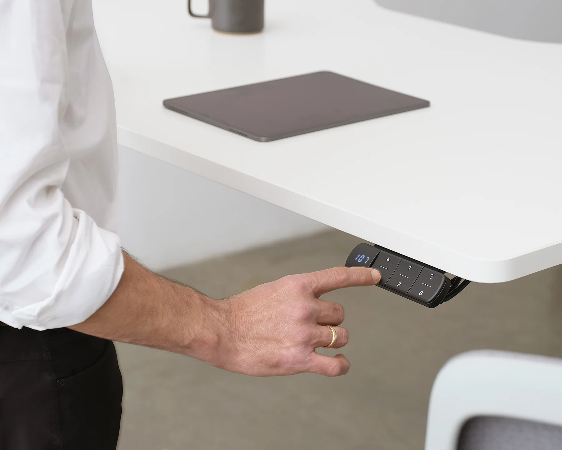 Person using Haven standing desk in modern NZ workplace