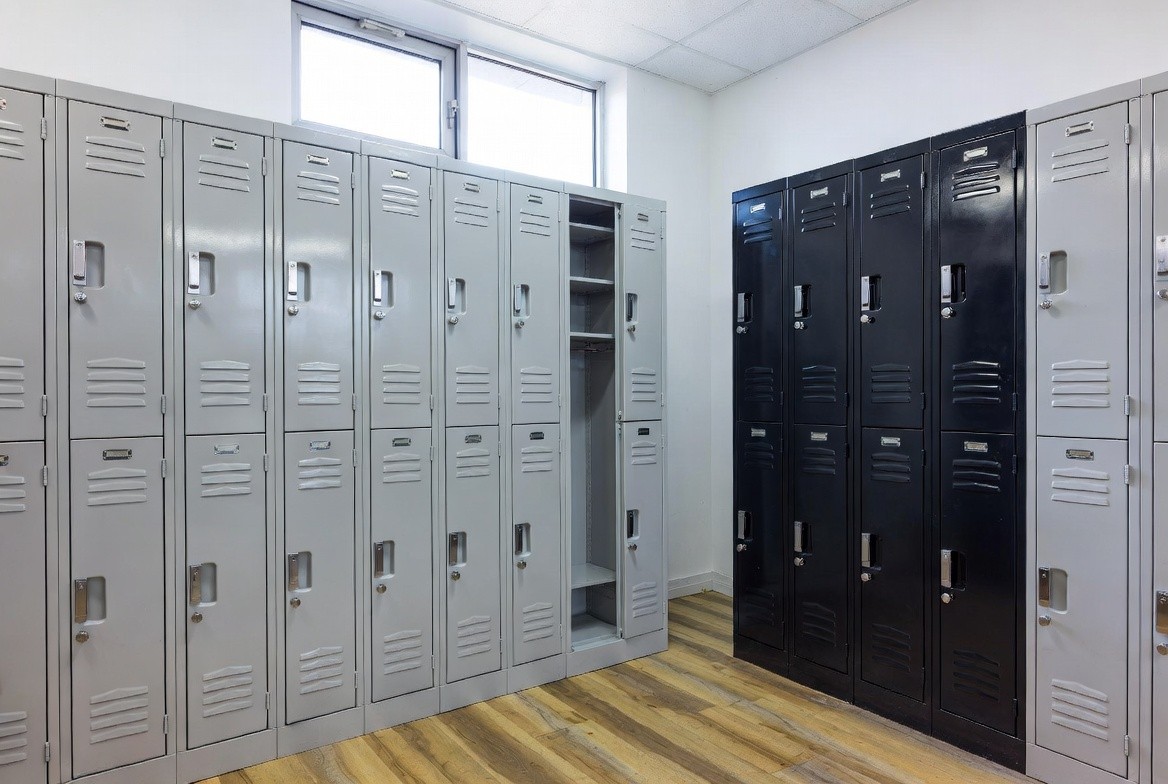 Row of modern metal locker cabinets in a clean New Zealand commercial office or gym environment