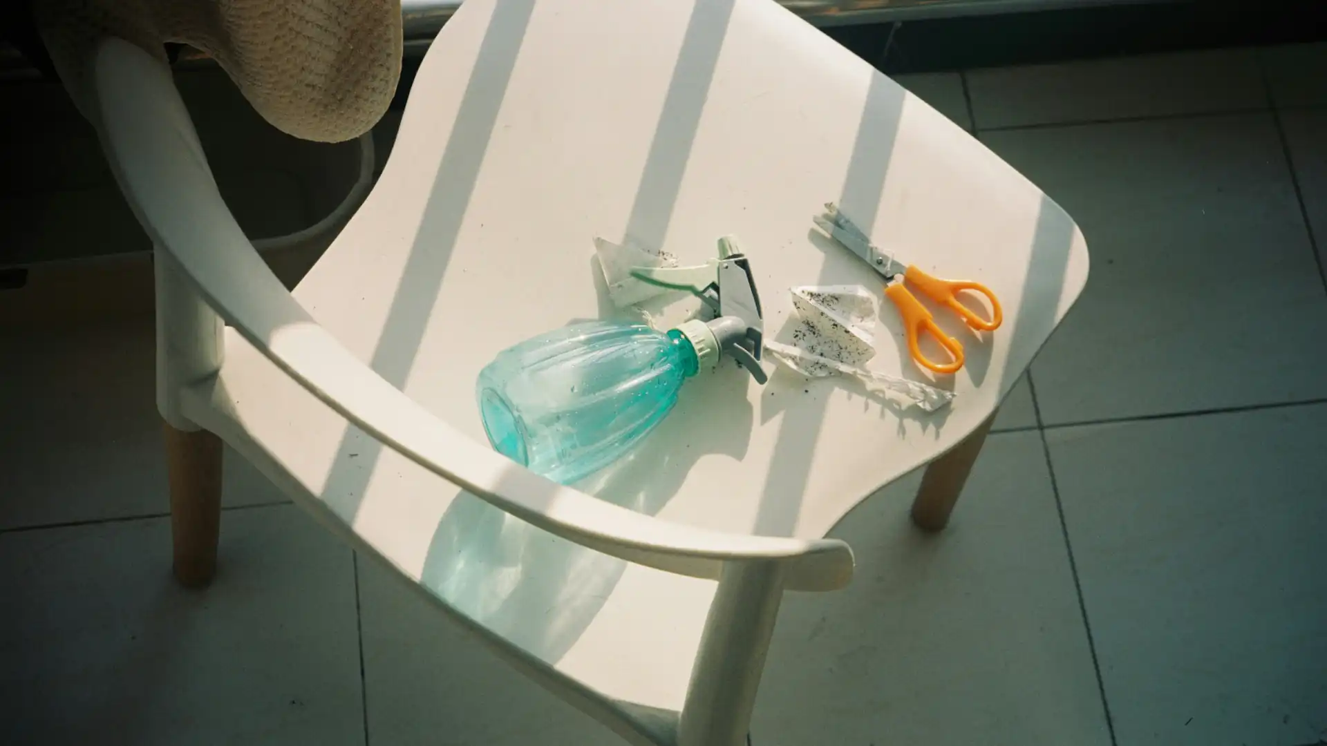 Cleaning and polishing a white plastic chair