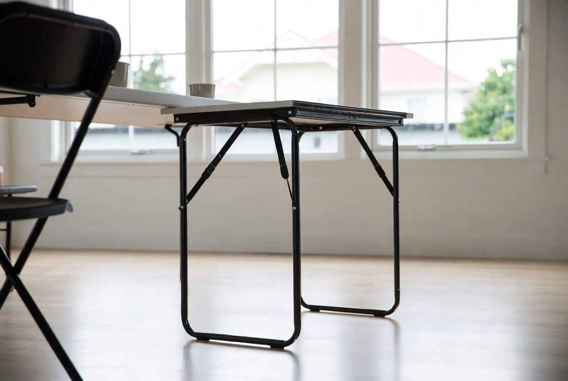 Lightweight folding table set up in modern NZ home or event space