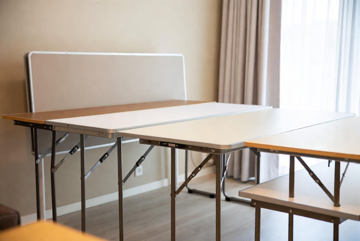 Compact portable folding tables suitable for homes and events