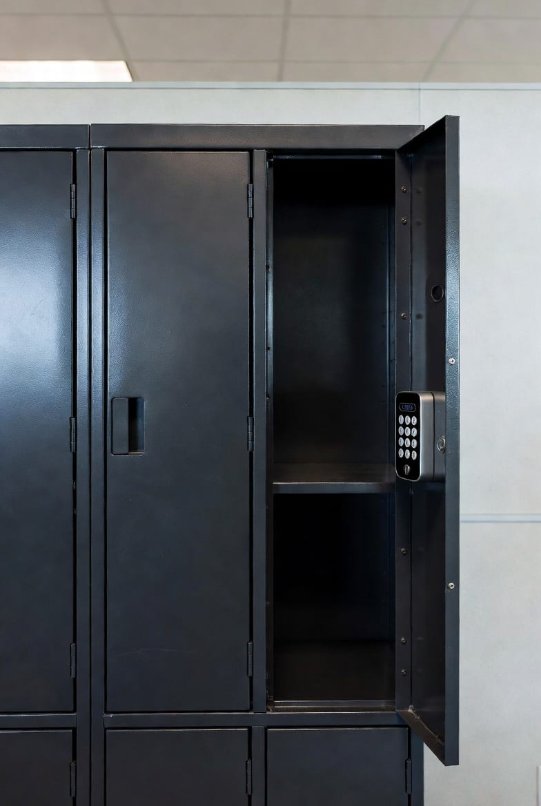 Secure black metal locker with electronic lock in modern office environment