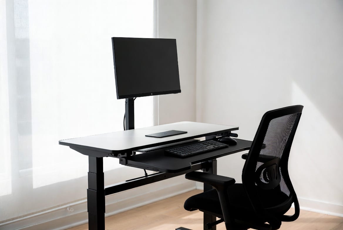 Modern standing desk setup in a New Zealand office or home workspace